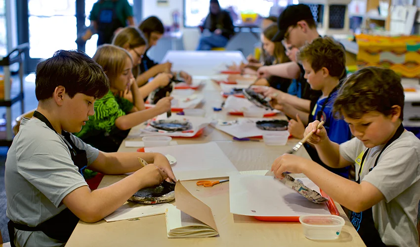 photo of kids crafting at a long table